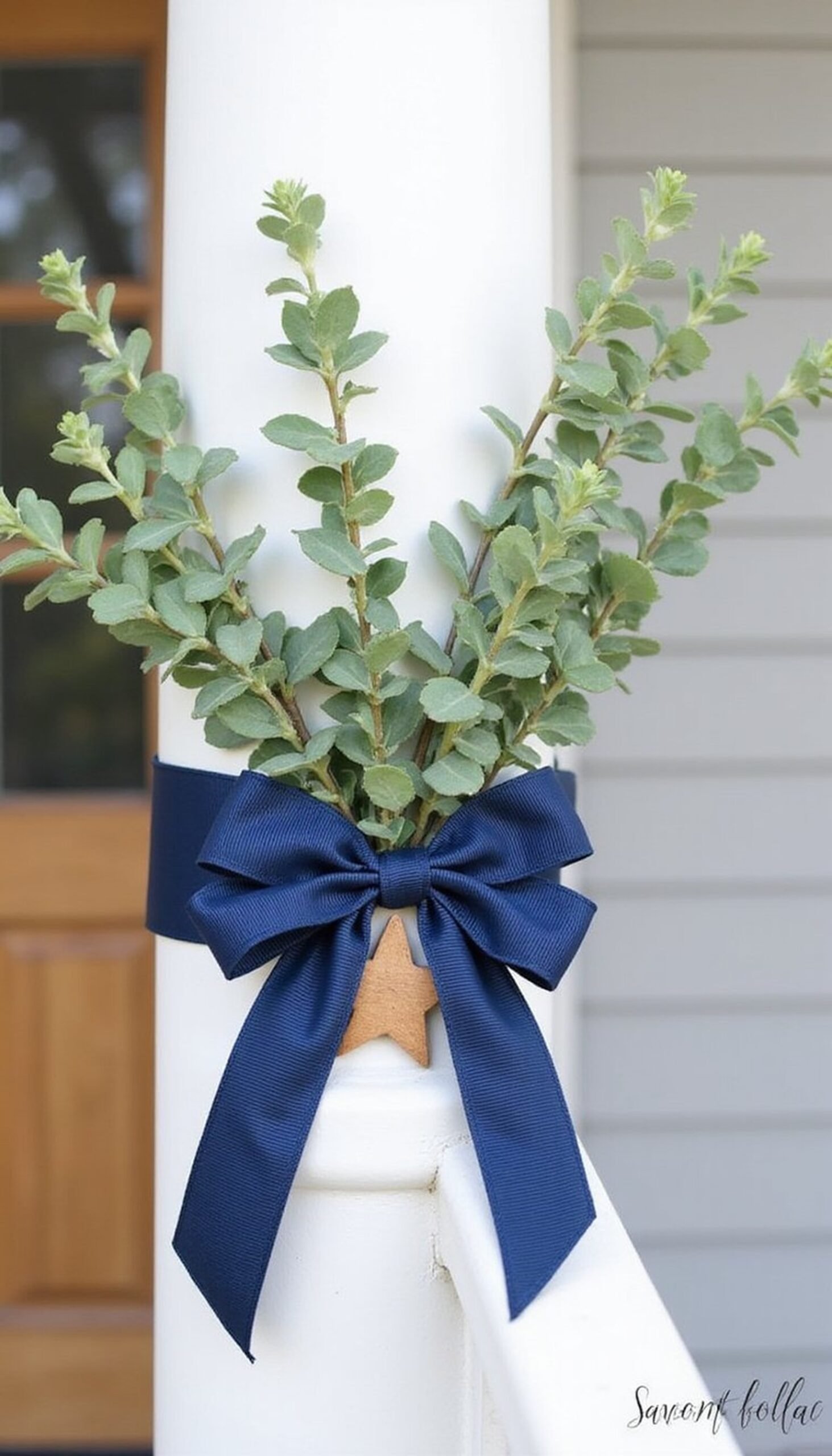 Porch post wraps with ribbon and greenery